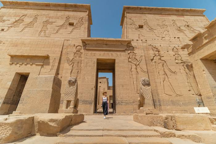 A Tourist Stands Infront of Philae Temple in Aswan