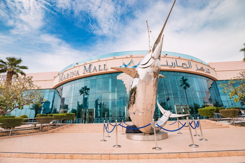 Marina mall entrance with steel swordfish sculpture Marina mall entrance with steel swordfish sculpture